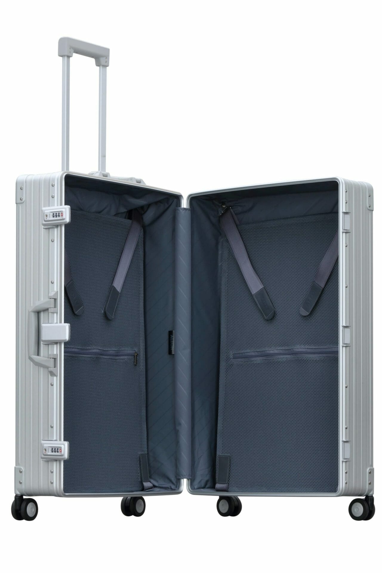30″-Macro-Traveler-silver-aluminum-wheeled-luggage|ALEON silver Macro Traveler Checked Case in brushed aluminum finish, standing upright with reinforced corners and dual lock latches, showcasing its sleek and durable design.|ALEON silver platinum Macro Traveler Checked Case open to reveal organized interior with compression straps and a zippered divider, ensuring secure storage for travel essentia