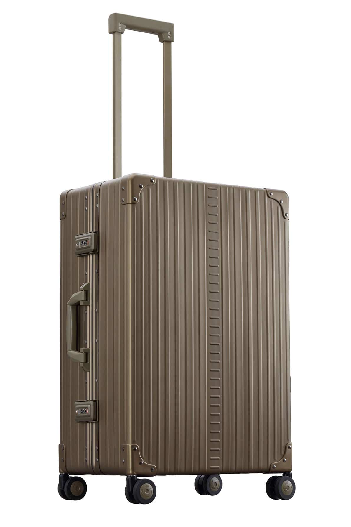 26 inch aluminum checked suitcase with wheels|Side profile view of Aleon checked case with TSA approved locks|Front view of Aleon checked case with spinner wheels|Open view of Aleon bronze case with compression boards|26 inch check aluminum luggage video|26 inch aluminum checked suitcase with wheels in bronze