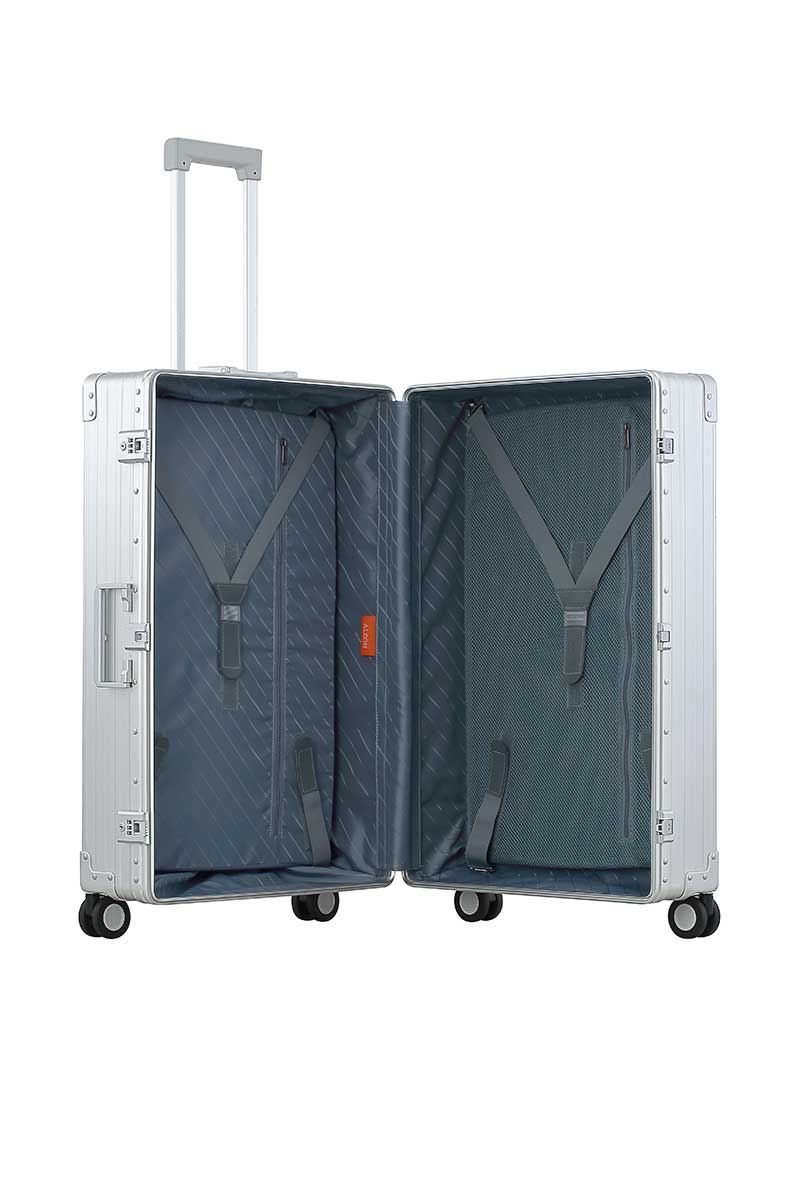 30″-Macro-Traveler-silver-aluminum-wheeled-luggage|ALEON silver Macro Traveler Checked Case in brushed aluminum finish, standing upright with reinforced corners and dual lock latches, showcasing its sleek and durable design.|ALEON silver platinum Macro Traveler Checked Case open to reveal organized interior with compression straps and a zippered divider, ensuring secure storage for travel essentia