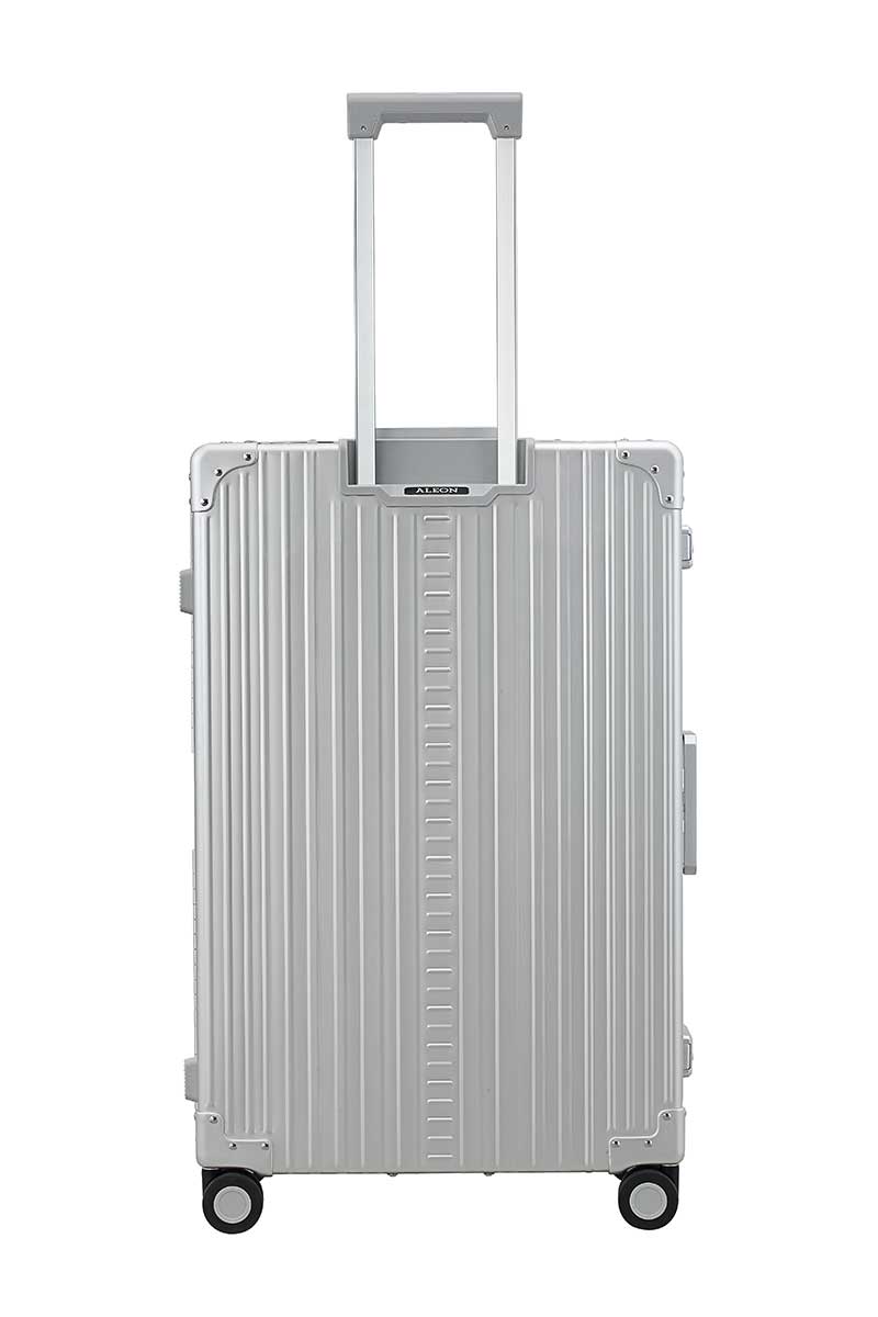30″-Macro-Traveler-silver-aluminum-wheeled-luggage|ALEON silver Macro Traveler Checked Case in brushed aluminum finish, standing upright with reinforced corners and dual lock latches, showcasing its sleek and durable design.|ALEON silver platinum Macro Traveler Checked Case open to reveal organized interior with compression straps and a zippered divider, ensuring secure storage for travel essentia
