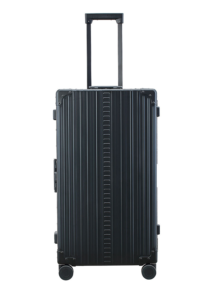 Sleek Onyx Black Aluminum Trunk – Durable 30-inch Checked Luggage|A close-up of the onyx suitcase’s high-density double quad wheels, designed for smooth 360-degree rotation. The aluminum side handle is visible, offering an alternative carrying option for convenience.|The black suitcase is fully opened, revealing a spacious interior with a fitted packing cube and a compression panel designed to kee