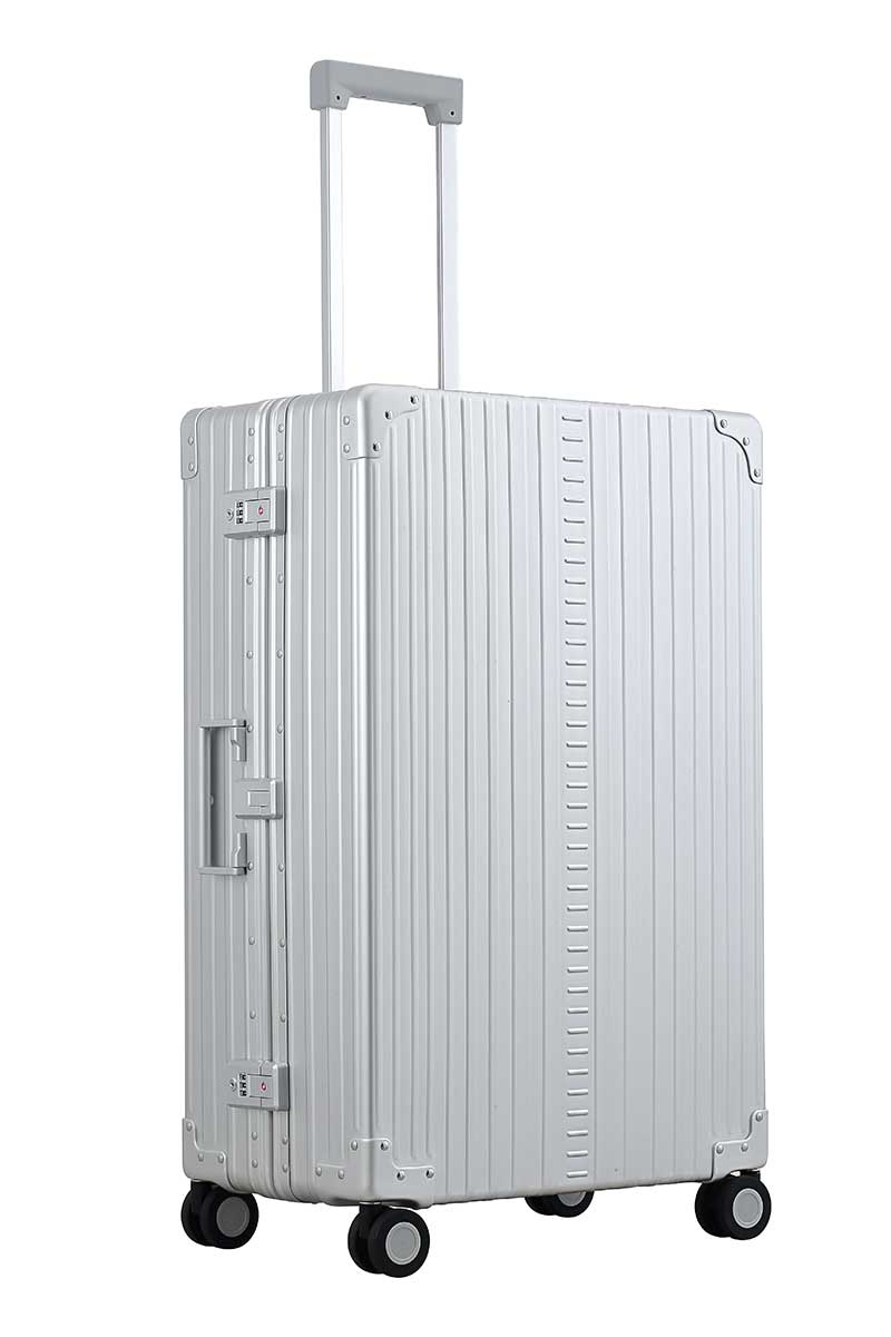 30″-Macro-Traveler-silver-aluminum-wheeled-luggage|ALEON silver Macro Traveler Checked Case in brushed aluminum finish, standing upright with reinforced corners and dual lock latches, showcasing its sleek and durable design.|ALEON silver platinum Macro Traveler Checked Case open to reveal organized interior with compression straps and a zippered divider, ensuring secure storage for travel essentia
