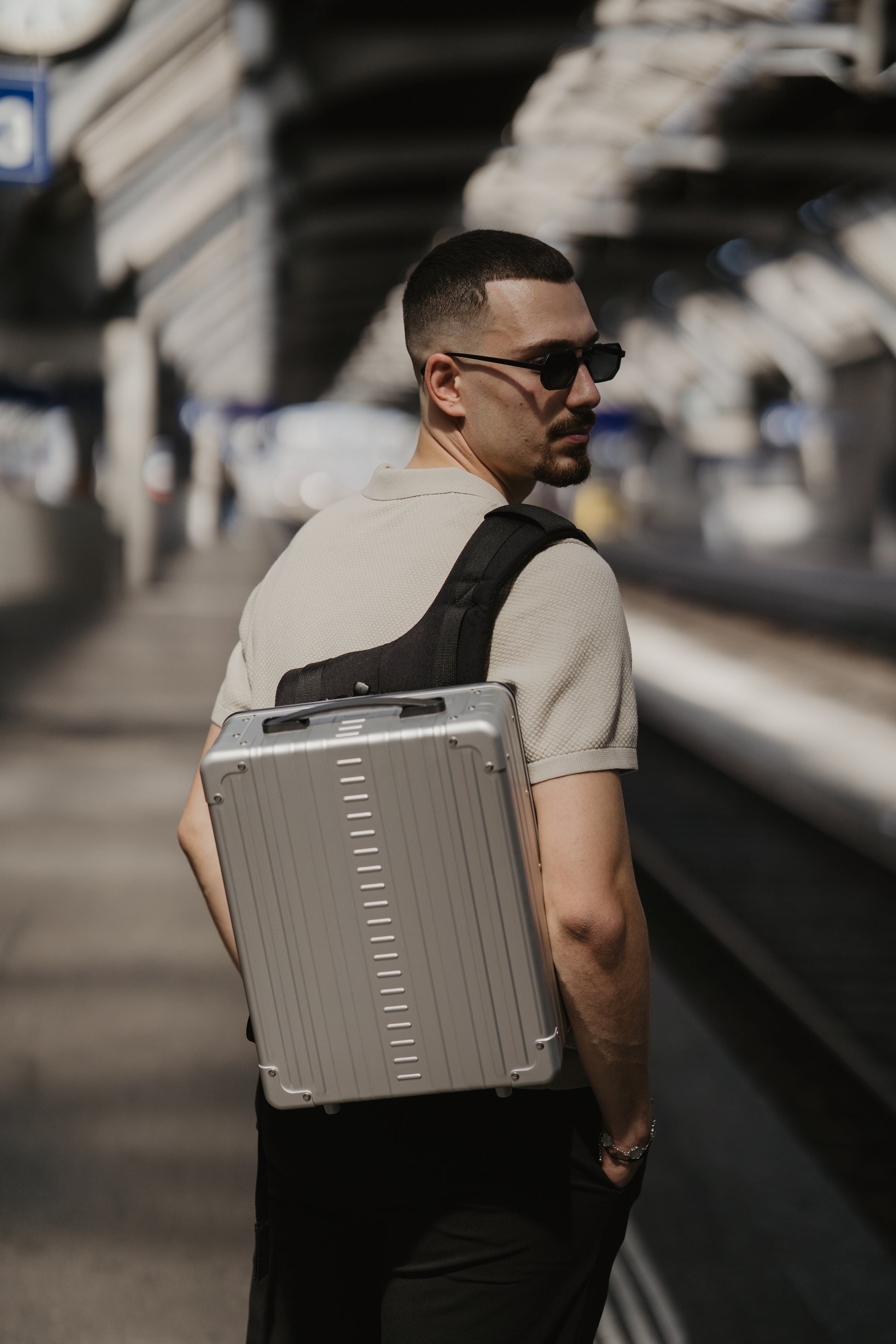 Aleon Platinum aluminum backpack worn for travel and daily commuting