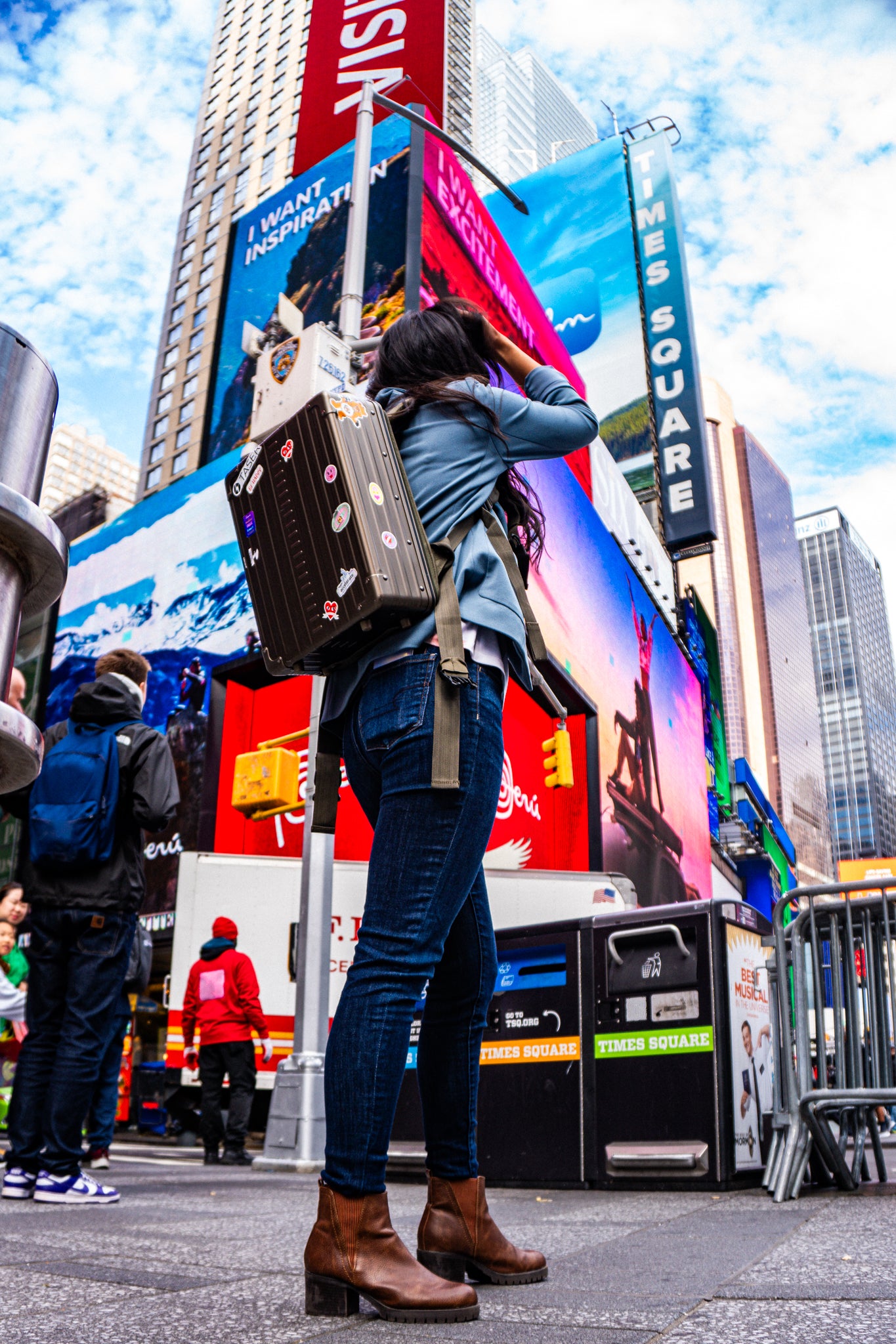 Aleon Bronze aluminum backpack in lifestyle travel or commuting scene through New York