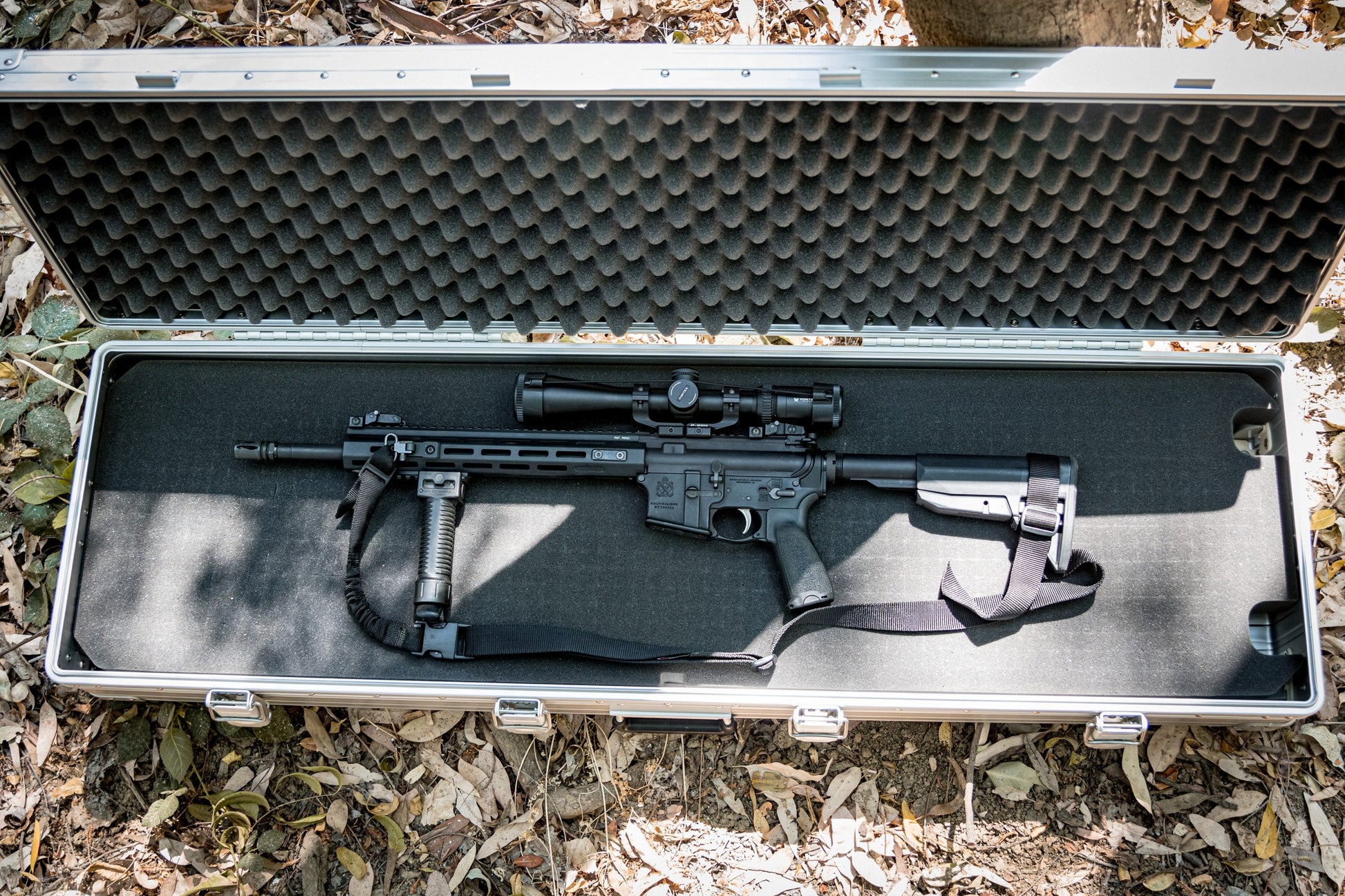 Interior view of Aleon 52-inch long case showing rifle fitted in adjustable foam for secure gear protection.