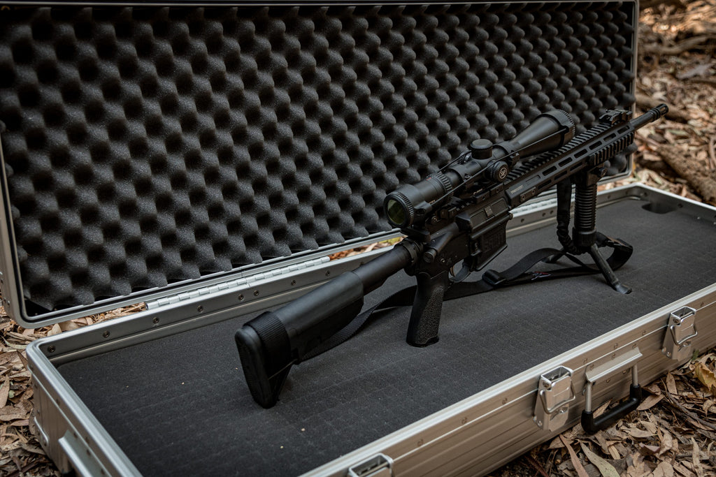 Aleon 52-inch long case open with rifle stored inside customizable foam interior for protective transport.