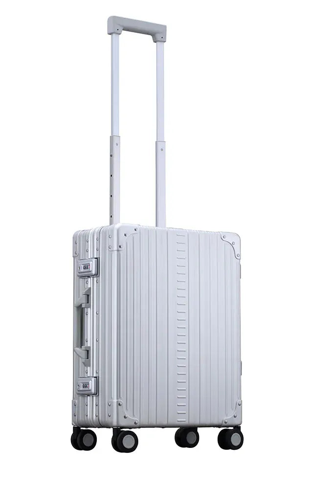 Side profile view of ALEON international carry on in platinum|Front view of ALEON international carry on crafted from aluminum||||International-carry-on-21-inches-in-silver-made-with-aluminum|international-carry-on-luggage made with aluminum overview video|21-Aluminum-International-Carry-On-Silver (1)|21-Aluminum-International-Carry-On--opened-with-2-conpression-boards-silver|21-Aluminum-Internati