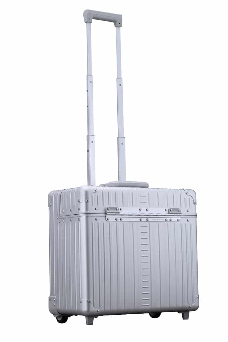 Pilot-case-aluminum-silver|Open platinum silver Aleon pilot case crafted from air craft grade aluminum|Aluminum pilot case with telescoping handle and full length piano hinge or unmatched durability|Silver pilot case with hands free carrying strap|Aluminum Pilots Case open and silver and black|Aluminum Pilots Case handle extended|Aluminum-pilotcase-silver-front-with-piano-hinges video overview|Alu