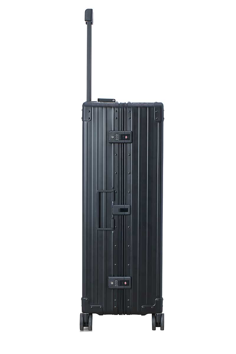 Black-32-inch-aluimunm-checked-bag|The black onyx ALEON 32″ Macro Plus glides smoothly through an airport terminal, its high-performance wheels designed for quiet and stable movement. The ergonomic telescoping handle ensures comfortable handling, even in bustling travel environments.|The ALEON 32″ black Macro Plus glides smoothly through an airport terminal, its high-performance wheels designed fo