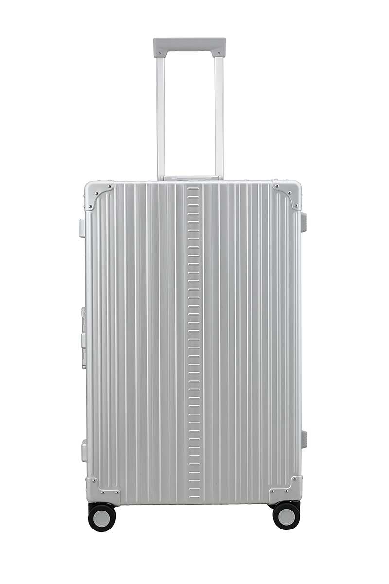 30″-Macro-Traveler-silver-aluminum-wheeled-luggage|ALEON silver Macro Traveler Checked Case in brushed aluminum finish, standing upright with reinforced corners and dual lock latches, showcasing its sleek and durable design.|ALEON silver platinum Macro Traveler Checked Case open to reveal organized interior with compression straps and a zippered divider, ensuring secure storage for travel essentia