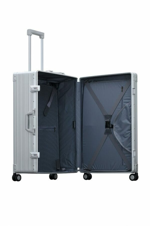26 inch Aluminum suitcase with garment bag trunk style|Side profile view of platinum silver checked traveler case made from aluminum|Open view of Aleon checked case with Suiter|Lock view of Aleon checked case in silver platinum with spinner wheels|Hinge view of Aleon checked case with full length piano hinge for unbeatable durability|26 inch Aluminum suitcase with garment bag trunk style|the suite