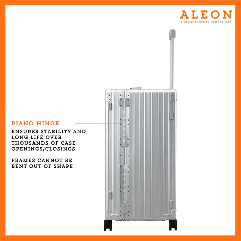 A detailed view of the silver suitcase’s full-length aluminum piano hinge, seamlessly integrated into the design for enhanced durability. The riveted construction ensures smooth opening and closing, reinforcing the case’s secure structure.