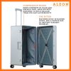 The platinum suitcase is fully opened, revealing a spacious interior with a fitted packing cube and a compression panel designed to keep belongings secure and wrinkle-free. The seamless rubber seal lining ensures protection against moisture and dust.
