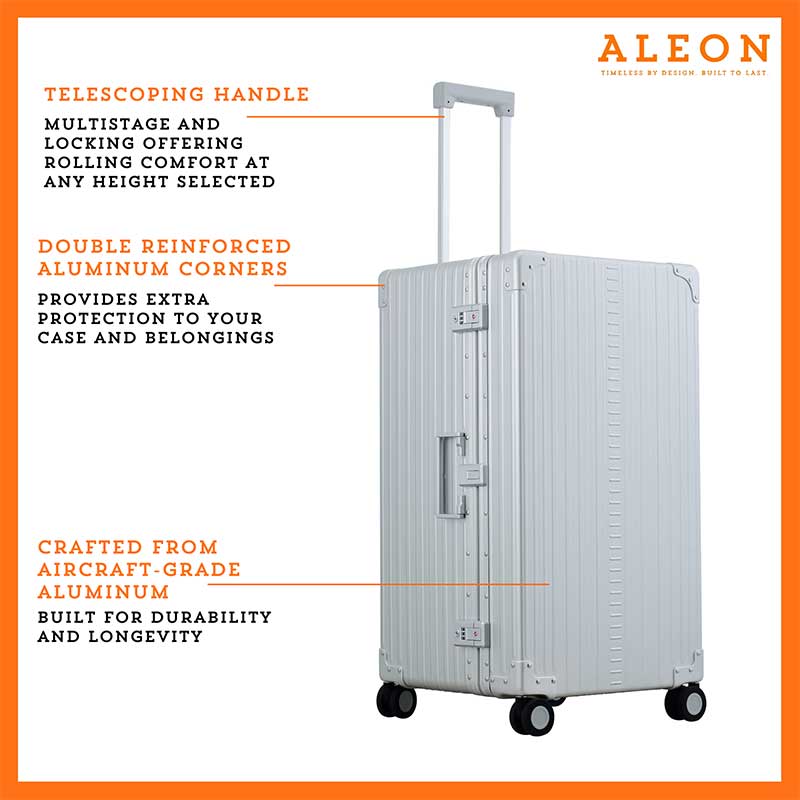 A close-up of the silver suitcase’s high-density double quad wheels, designed for smooth 360-degree rotation. The aluminum side handle is visible, offering an alternative carrying option for convenience.