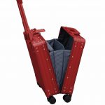 Red aluminum luggage for an over night business carry on case