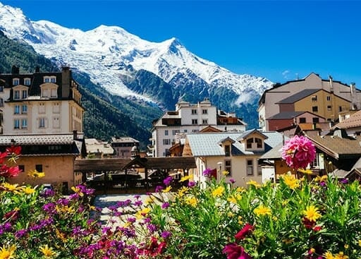 Chamonix france with snow cap mountains and flowers