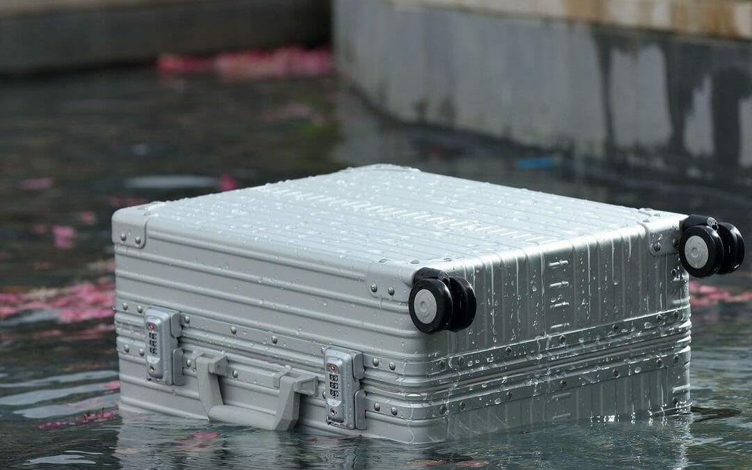 aluminum carry-on luggage in water