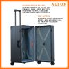 The black suitcase is fully opened, revealing a spacious interior with a fitted packing cube and a compression panel designed to keep belongings secure and wrinkle-free. The seamless rubber seal lining ensures protection against moisture and dust.