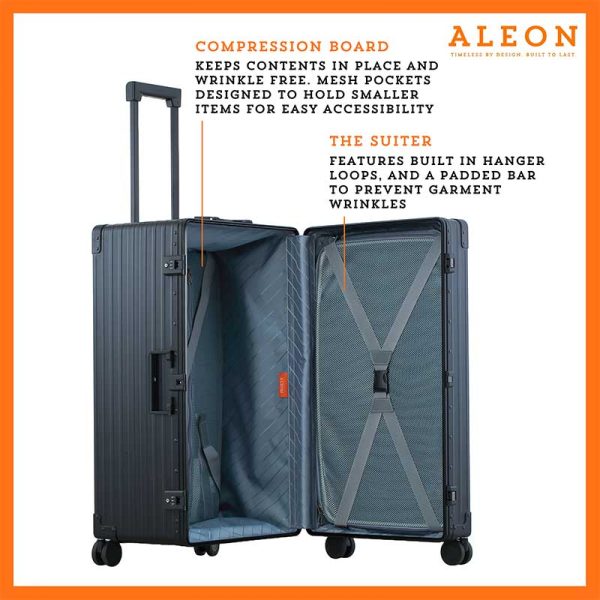 The black suitcase is fully opened, revealing a spacious interior with a fitted packing cube and a compression panel designed to keep belongings secure and wrinkle-free. The seamless rubber seal lining ensures protection against moisture and dust.
