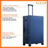 The ALEON 32″ Macro Plus Traveler Large Check-In, crafted from aircraft-grade aluminum, stands upright on a pristine hotel lobby floor. Its hard-shell design, reinforced corners, and TSA-approved locks emphasize security and durability for long-haul journeys.