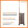 The ALEON 21" Carry-On glides effortlessly through a busy terminal, its precision-engineered wheels navigating the polished flooring with ease. The sturdy telescoping handle ensures a comfortable grip for travelers.