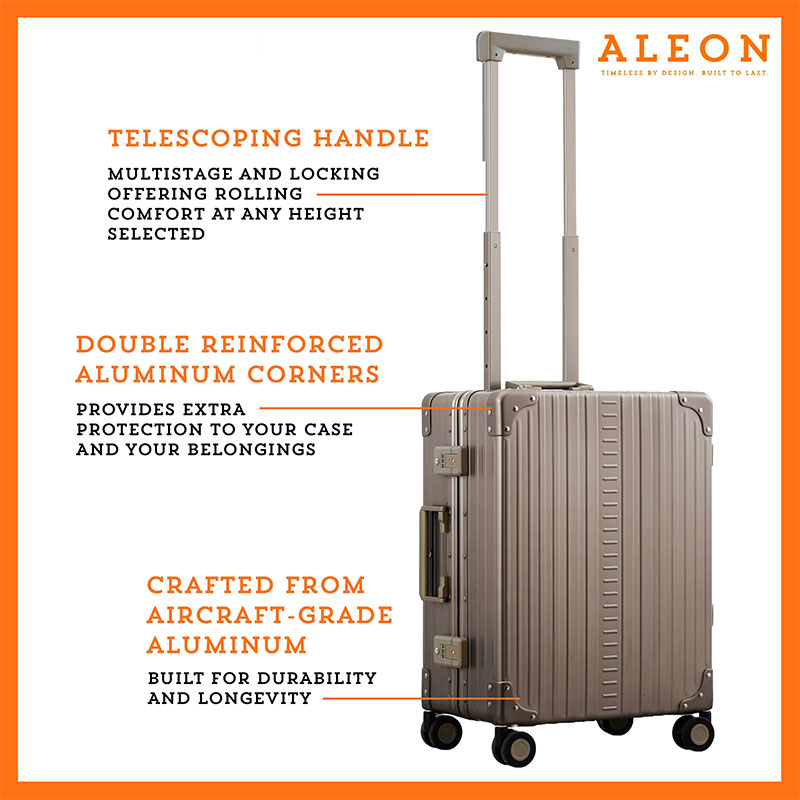 B01LZO1GXS-CH-side-(2) A polished aluminum ALEON 21" Carry-On stands upright on a glossy airport floor, reflecting ambient lighting. Its durable, hard-shell construction and smooth wheels embody modern travel efficiency.