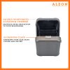 ALEON vertical bronze crossbody case displayed with highlighted features, including double reinforced aluminum corners for enhanced durability and an aluminum clasp for secure closure. The case is open, revealing organized interior compartments. Brand name 'ALEON' and tagline 'TIMELESS BY DESIGN. BUILT TO LAST.' are shown at the top right.