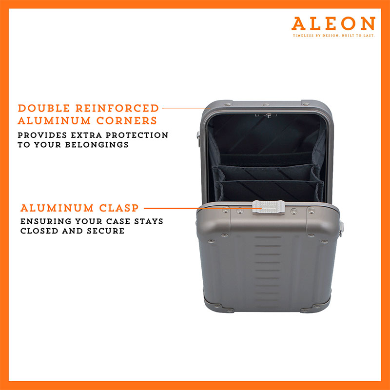 1905-V-BR-open-front ALEON vertical bronze crossbody case displayed with highlighted features, including double reinforced aluminum corners for enhanced durability and an aluminum clasp for secure closure. The case is open, revealing organized interior compartments. Brand name 'ALEON' and tagline 'TIMELESS BY DESIGN. BUILT TO LAST.' are shown at the top right.
