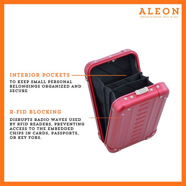 Aleon vertical red ruby crossbody bag featuring interior RFID-blocking pockets for secure storage. The bag is open, showcasing multiple organized compartments designed to protect personal items such as cards and passports. Aleon logo and tagline 'Timeless by design. Built to last.' are displayed in the top right corner.