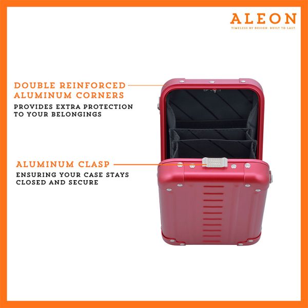 ALEON vertical ruby crossbody case displayed with highlighted features, including double reinforced aluminum corners for enhanced durability and an aluminum clasp for secure closure. The case is open, revealing organized interior compartments. Brand name 'ALEON' and tagline 'TIMELESS BY DESIGN. BUILT TO LAST.' are shown at the top right.