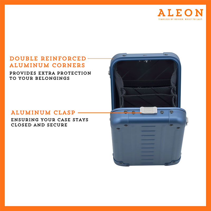 ALEON vertical sapphire crossbody case displayed with highlighted features, including double reinforced aluminum corners for enhanced durability and an aluminum clasp for secure closure. The case is open, revealing organized interior compartments. Brand name 'ALEON' and tagline 'TIMELESS BY DESIGN. BUILT TO LAST.' are shown at the top right.