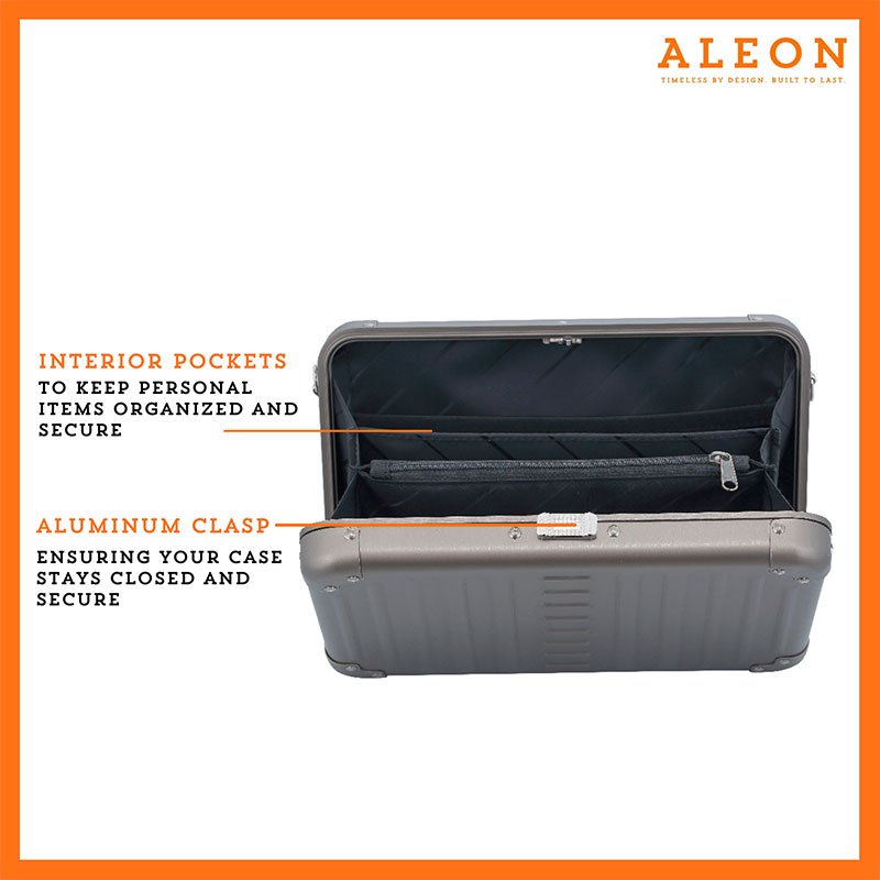 ALEON large bronze crossbody case displayed with highlighted features, including double reinforced aluminum corners for enhanced durability and an aluminum clasp for secure closure. The case is open, revealing organized interior compartments. Brand name 'ALEON' and tagline 'TIMELESS BY DESIGN. BUILT TO LAST.' are shown at the top right.