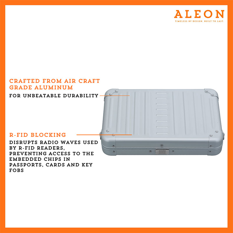 2505-PL Aleon large platinum silver crossbody bag featuring interior RFID-blocking pockets for secure storage. The bag is open, showcasing multiple organized compartments designed to protect personal items such as cards and passports. Aleon logo and tagline 'Timeless by design. Built to last.' are displayed in the top right corner.